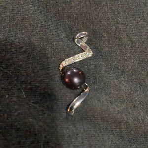 Silver, dark stone, cubic zirconia charm